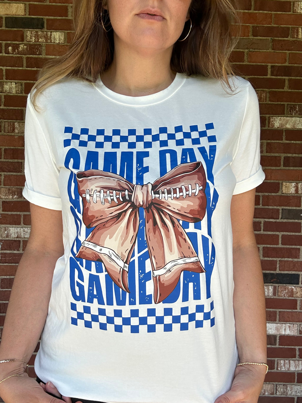 Game Day football bow graphic tee in white with blue checkered print