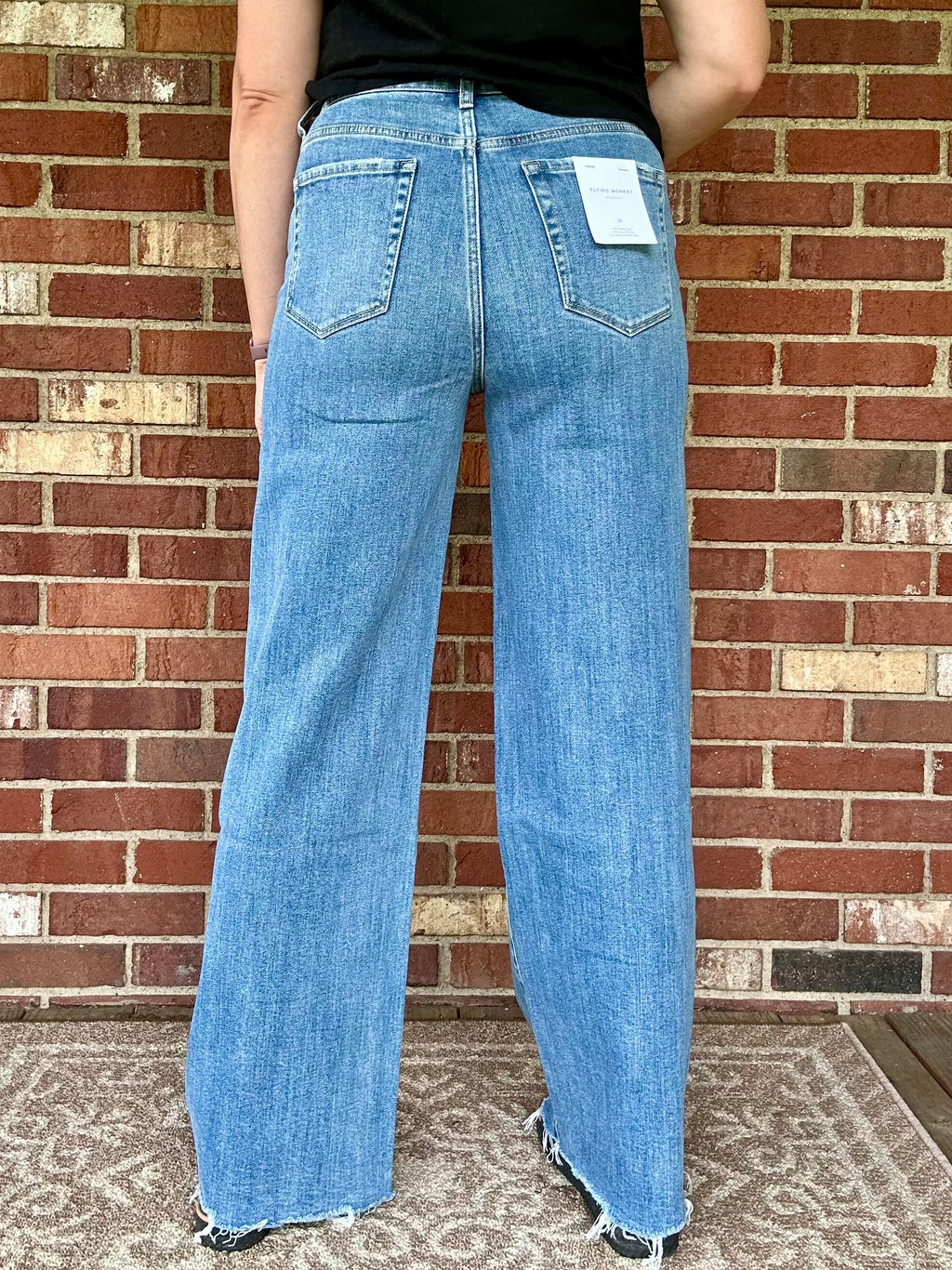 SUPER HIGH RISE MEDIUM WASH RAW HEM WIDE LEG JEANS