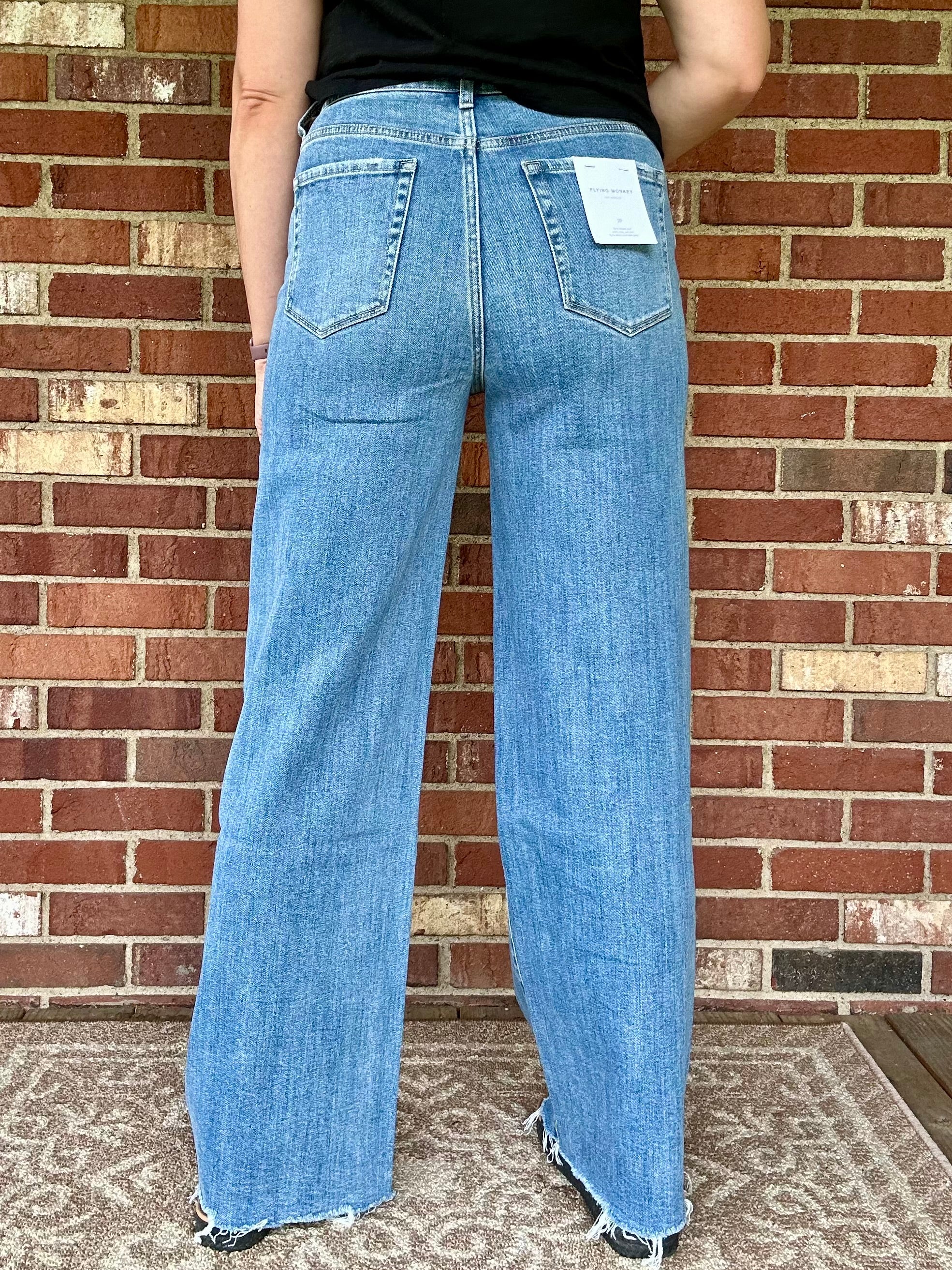 SUPER HIGH RISE MEDIUM WASH RAW HEM WIDE LEG JEANS